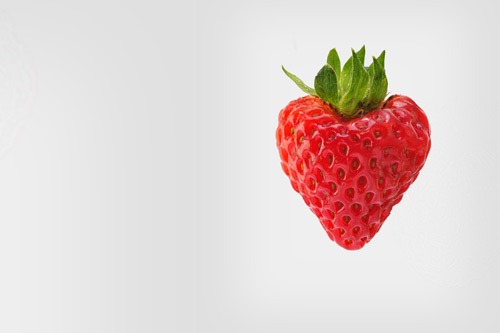 Strawberry in front of a white background.